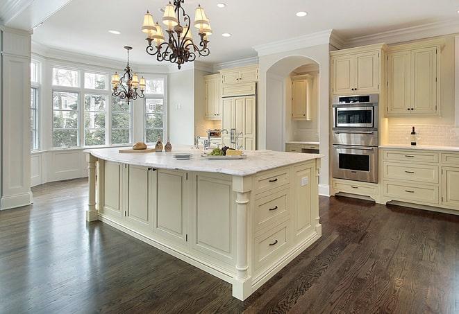 stylish bedroom with grey laminate floors in Bedford MA